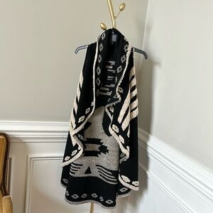 Women’s Ryan Michael southwestern style shearling and wool draped sweater vest.